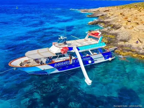 Passengers swimming in the clear water of the Blue Lagoon Malta