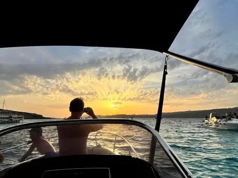 Speedboat entering a sea cave near the Crystal Lagoon on a private tour