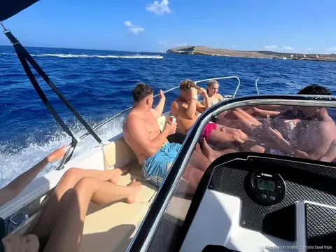 Group swimming from a private boat at the Blue Lagoon