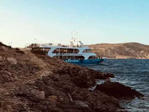 Swimmers in turquoise water at the Blue Lagoon anchorage